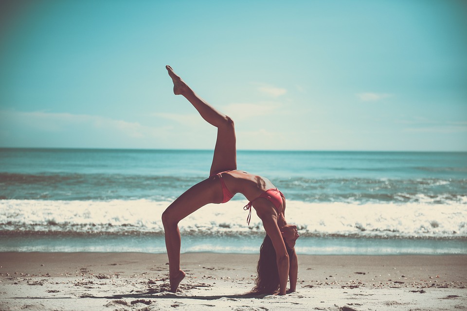 Francesca Panfili Yoga pose on the beach